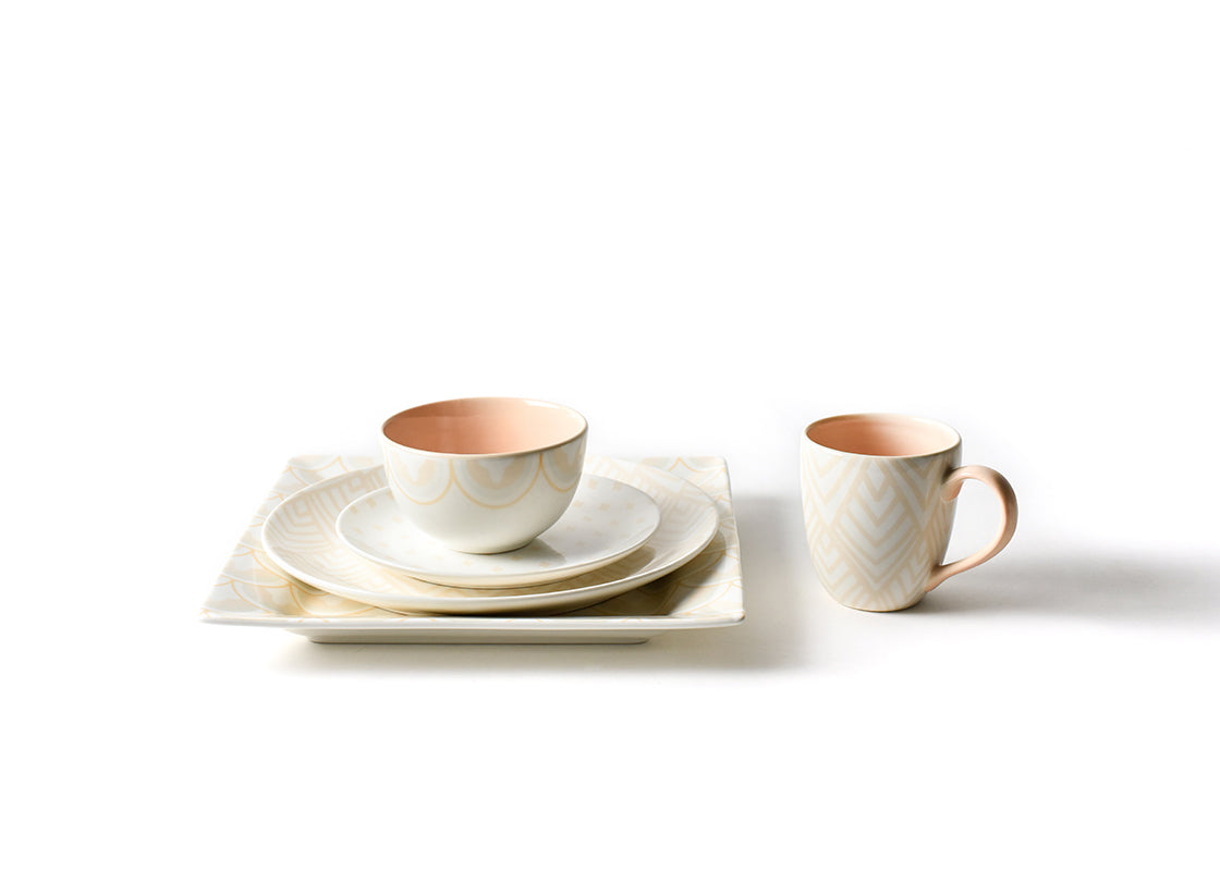 Front View of Stacked Coordinated Place Setting Including Blush Quatrefoil Salad Plate