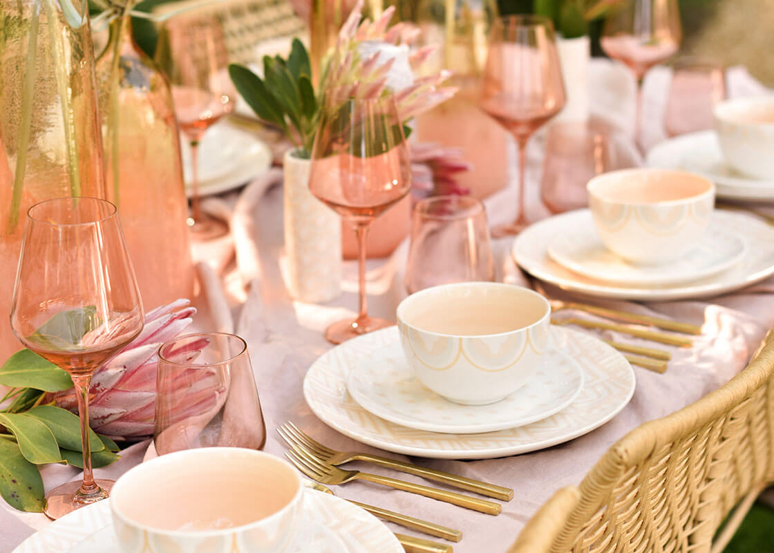 Front View of Upscale Blush Tablescape Featuring Salad Plates in Quatrefoil Design