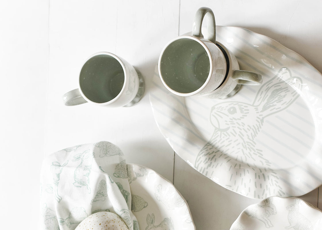 Overhead View of Speckled Rabbit Designs Including Ruffle Mugs and Platter