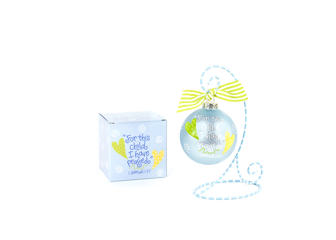 Front View of Blue For This Child Glass Ornament Placed on Light Blue and White Stripe Display Stand with Matching Box