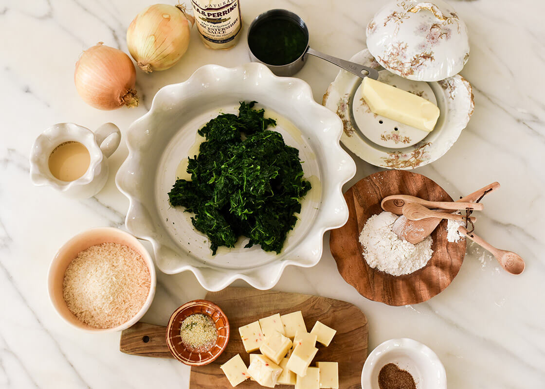 Overhead View of Coordinating Pieces Including Signature White 9in Ruffle Pie Dish Filled with Cooking Ingredients