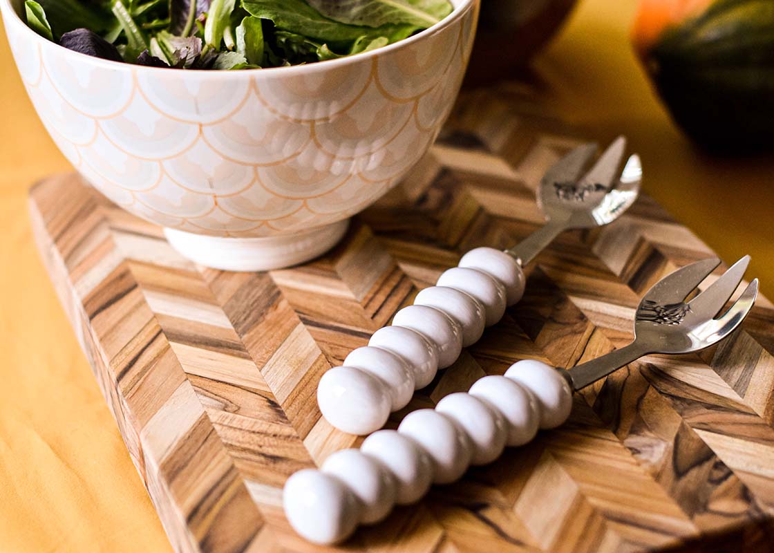 Cropped Close up of Signature White Knob Serving Spoon