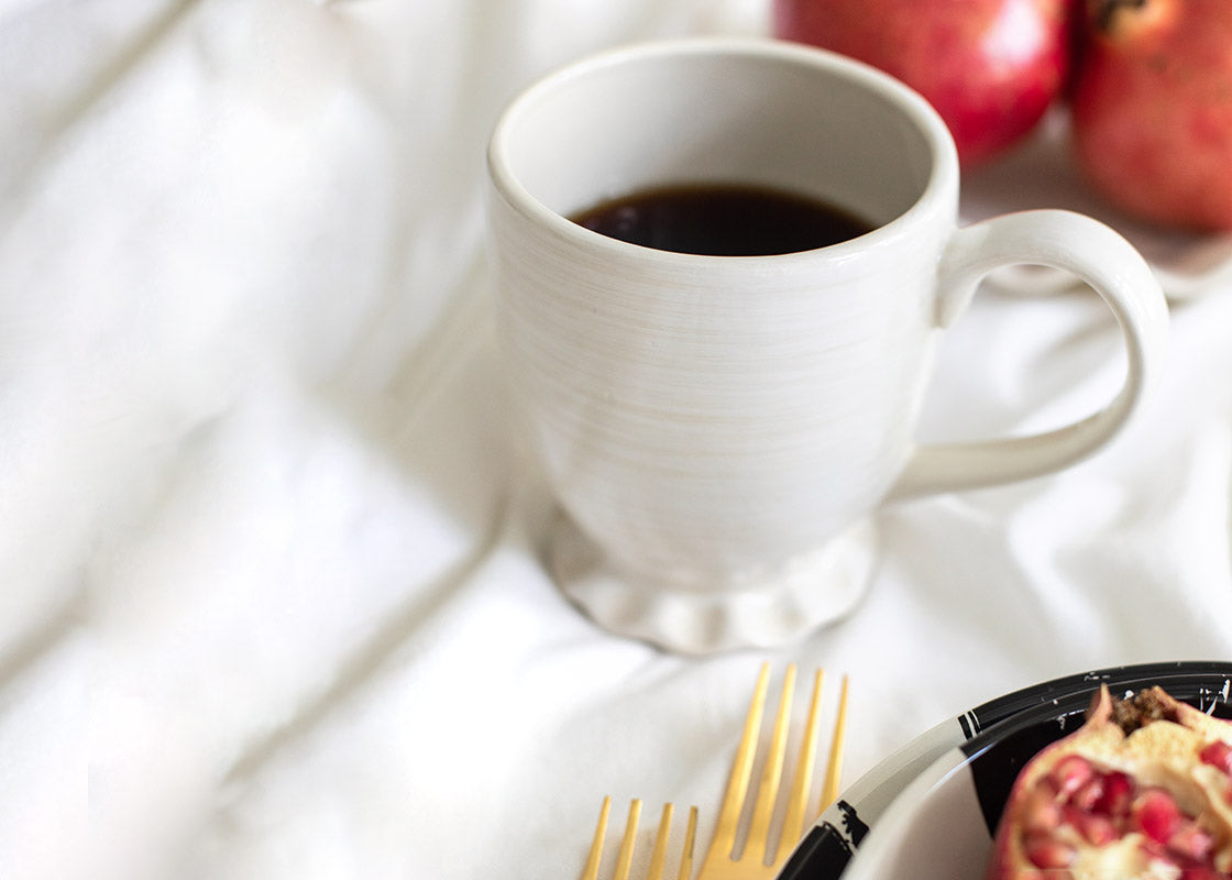 Cropped Close up of Signature White Ruffle Mug on Breakfast Table