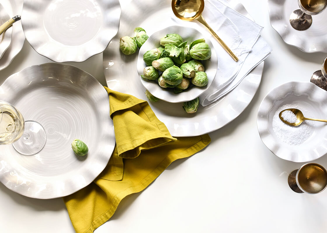 Cropped Close up of Casually Elegant Tableware Ruffle Design Small Flare Bowl in Signature White