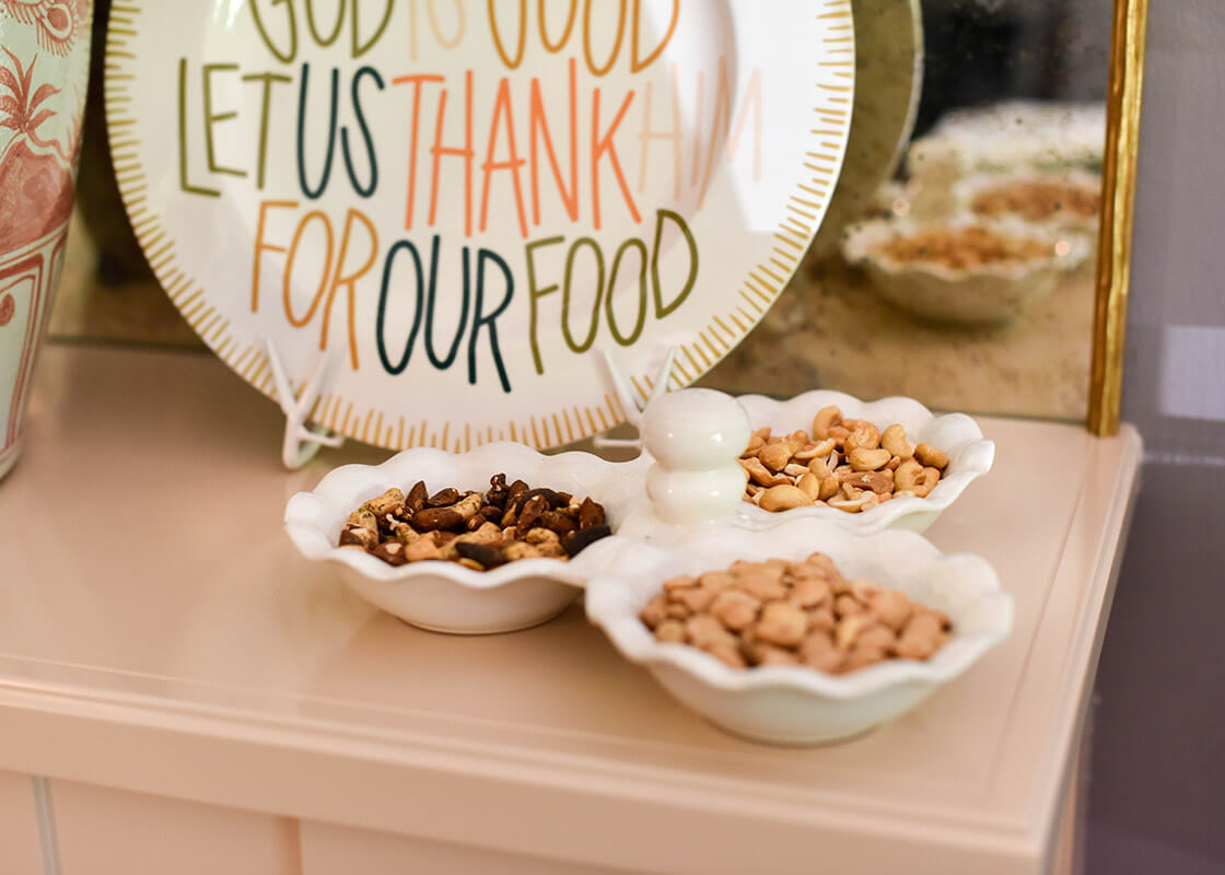 Cropped Close up of Signature White Ruffle Three Bowl Server filled with Assorted Nuts