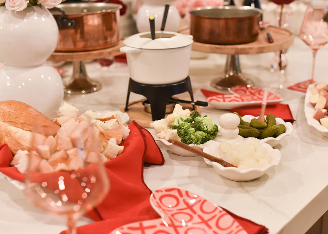 Front View of Signature White Ruffle Three Bowl Server holding Vegetables ready to dip in Fondue Pot