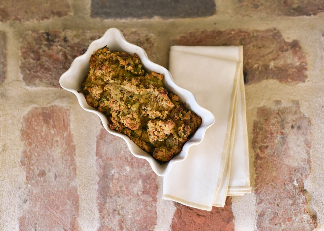 Overhead View of Oven-to-Table Signature White Ruffle Loaf Pan Serving Up a Delicious Recipe