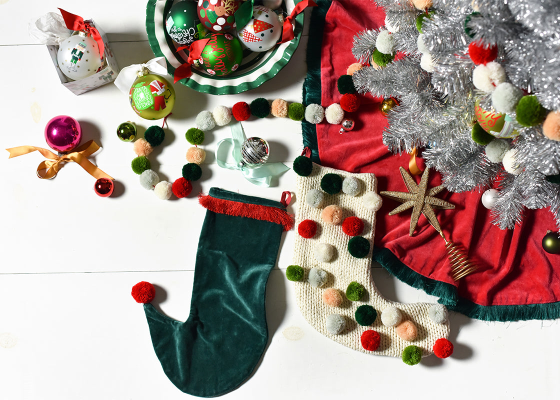 Overhead View of Christmas Designs Including Pine Velvet Stocking with Trim Under Silver Tinsel Tree