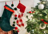 Red-trimmed Pine Velvet Stocking Hanging on Mantle with Other Chrsitmas Design Stockings