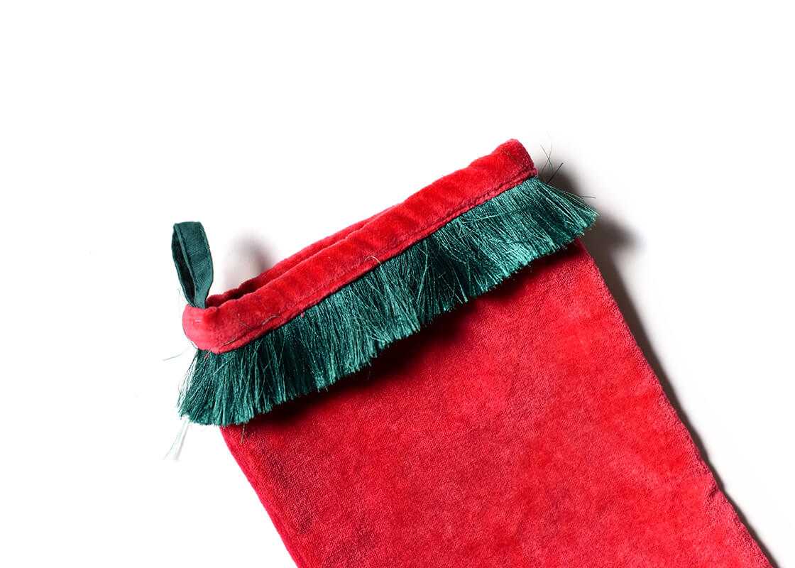 Cropped Close up of Loop Hanger and Pine Green Fringe Trim on Red Velvet Stocking with Trim