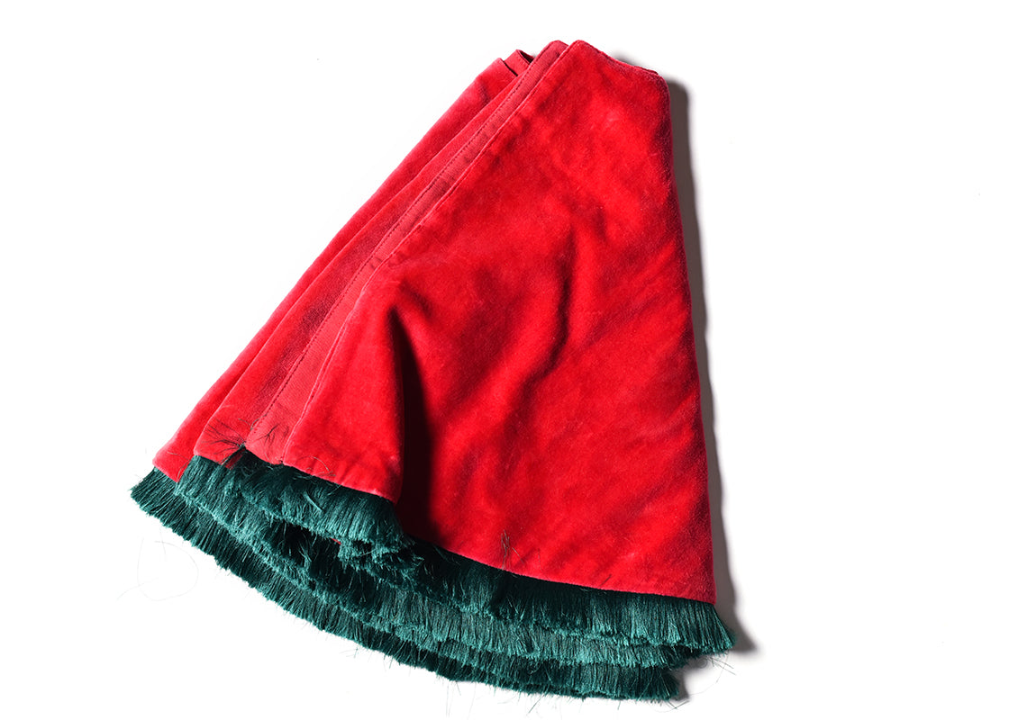 Overhead View of Folded Red Velvet Tree Skirt with Trim Showing Closer View of Design Details