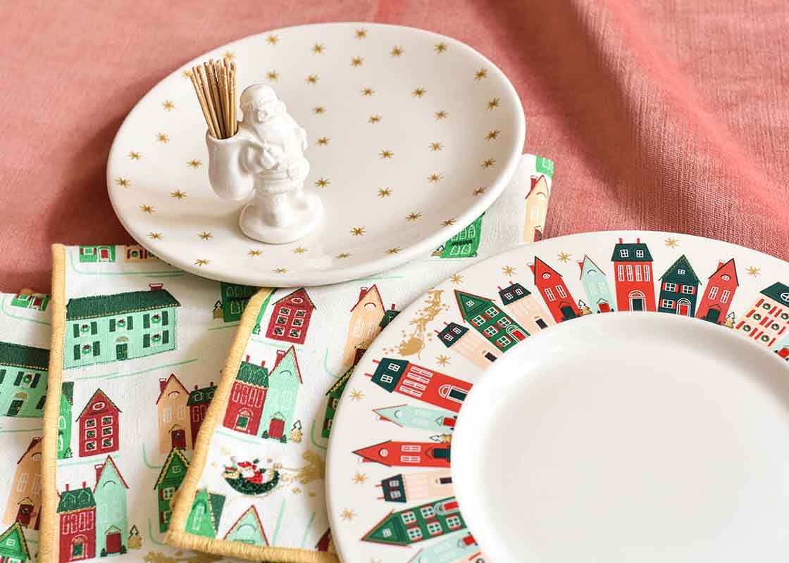 Overhead View of Holiday Dinnerware Including Gold Stars Salad Plate