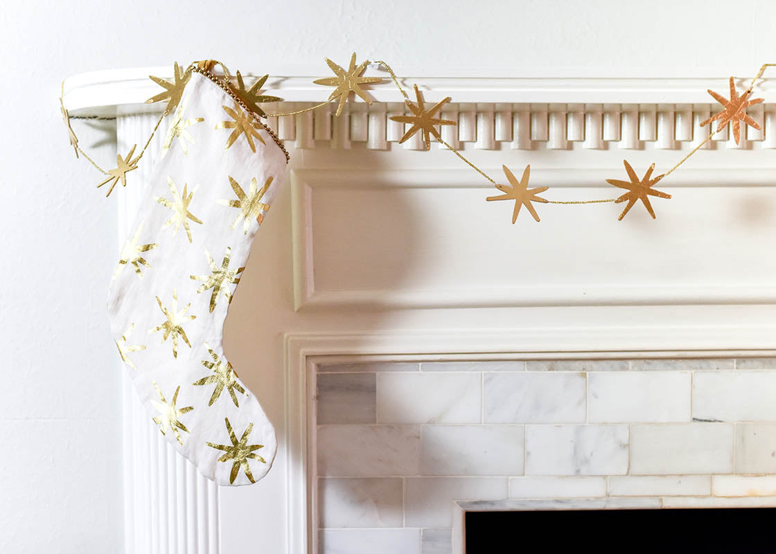 Front View of Garland of Stars with Gold Star Stocking on Mantle