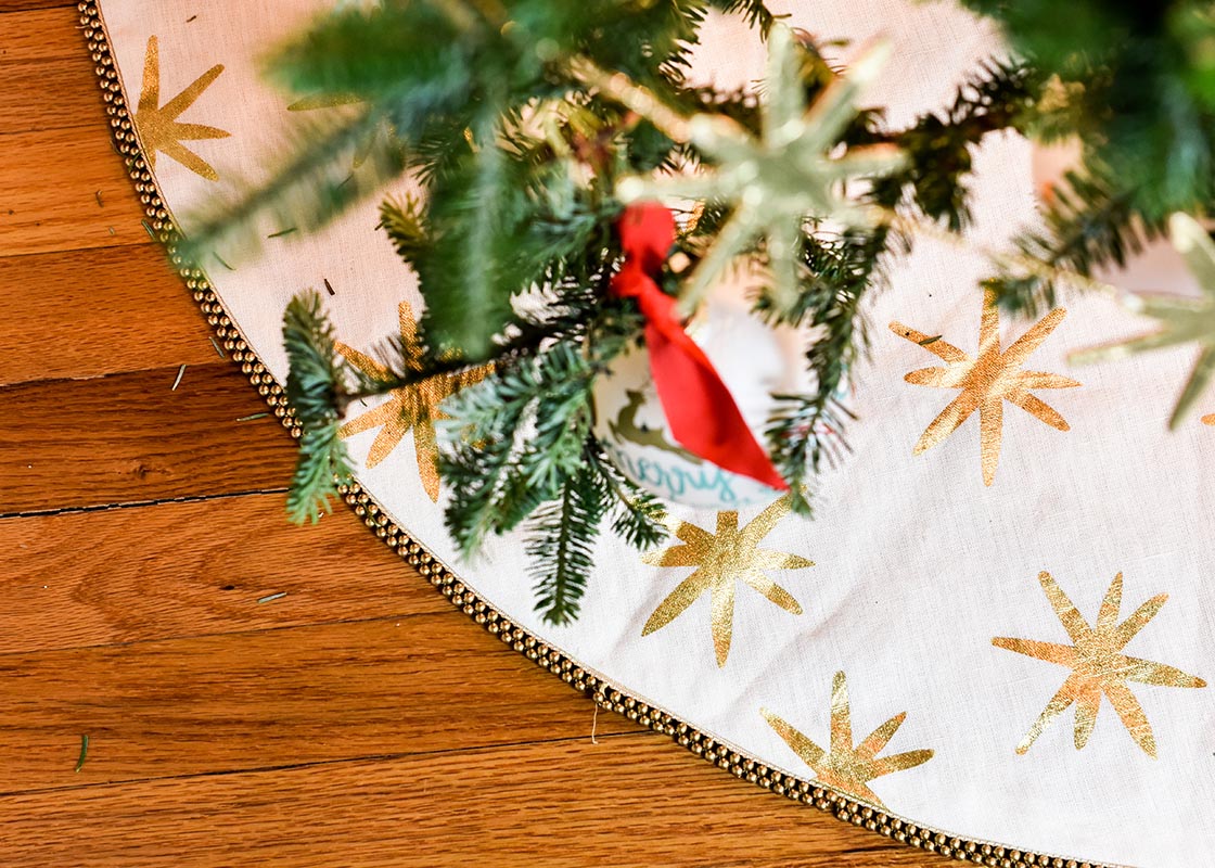 Overhead View of Gold Star Tree Skirt Under Christmas Tree