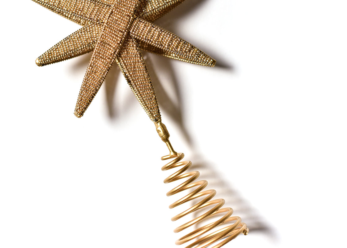 Cropped Close up of Spiral Holder of Gold Beaded Star Small Tree Topper