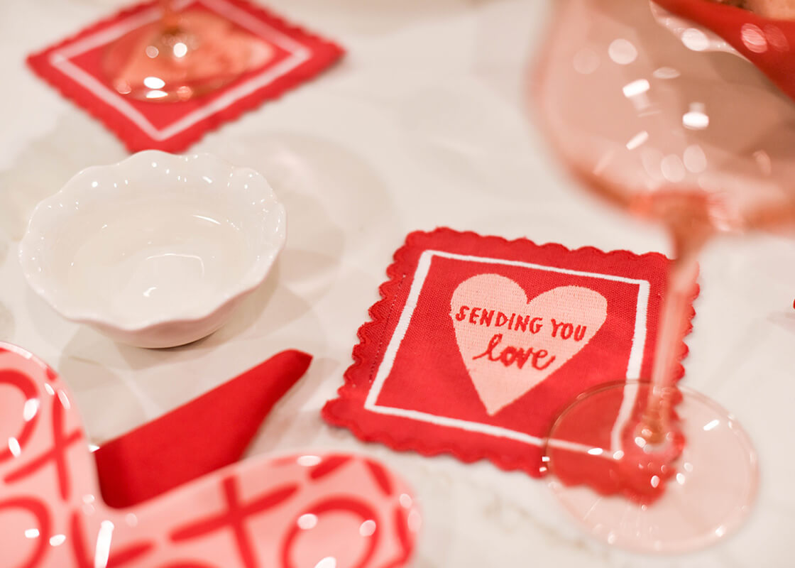 Extreme Cropped Close up of Stamp of Love Cocktail Napkins on Valentine's Themed Table