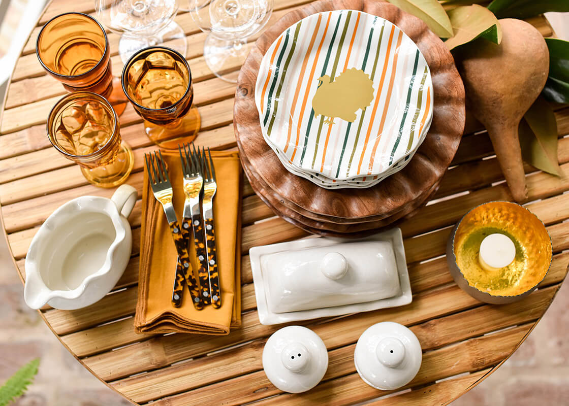 Overhead View of Stacks of Dinnerware Including Turkey Stripes Ruffle Salad Plate