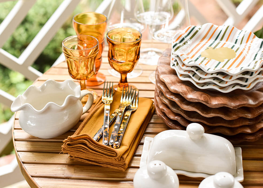 Front View of Stacks of Dishes Including Turkey Stripes Ruffle Salad Plate