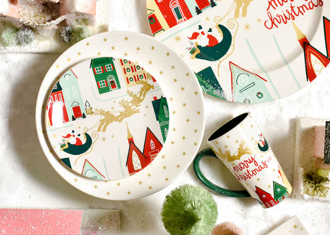 Cropped Close up of a Ceramic Christmas in the Village Salad Plate Coordinated with Coton Colors Holiday Designs