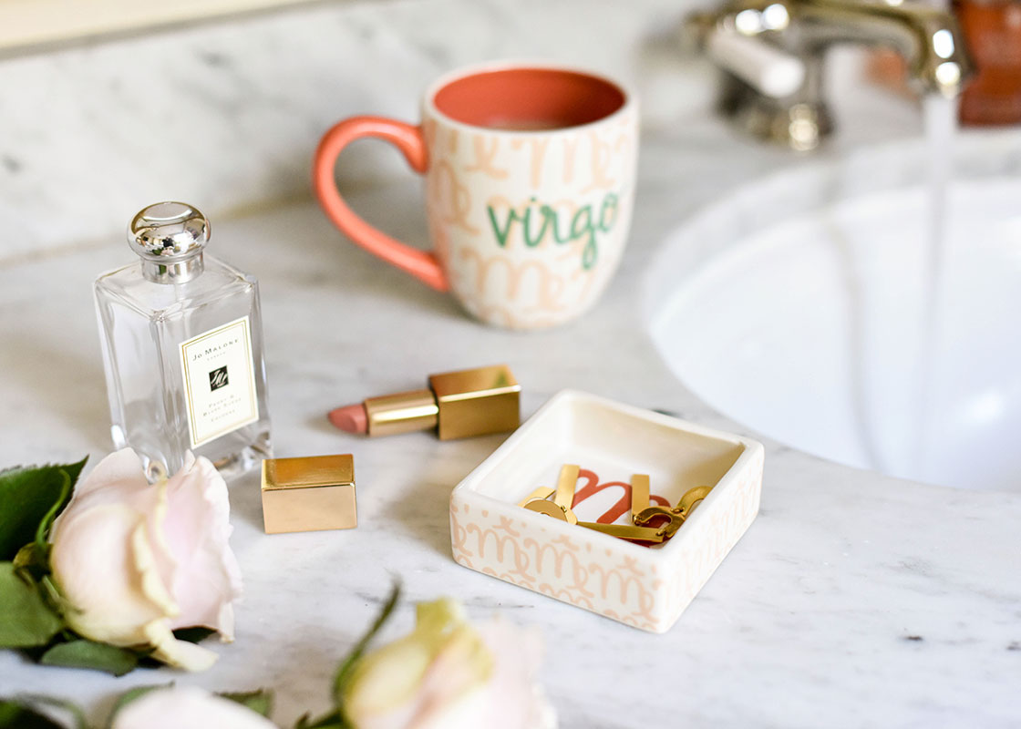 Cropped Close up of Zodiac Virgo Trinket Dish Holding Jewelry and Make up on Bathroom Vanity